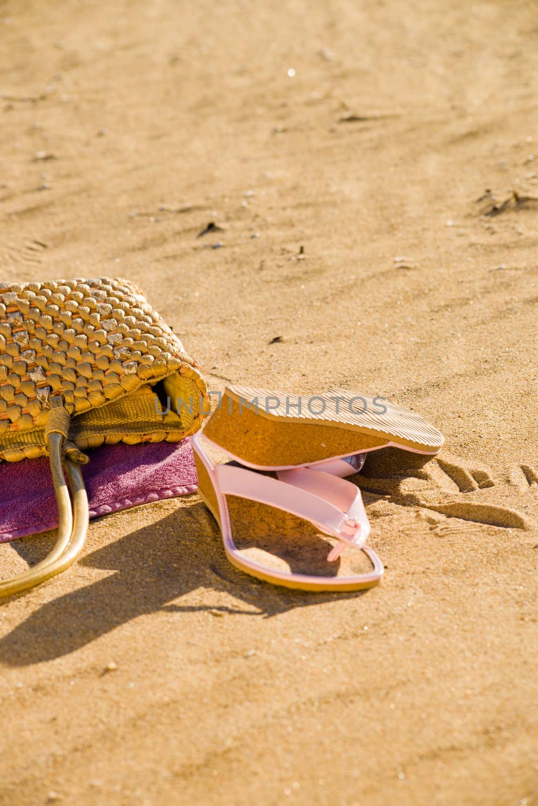 Summer items on a  sunny beach, a still life