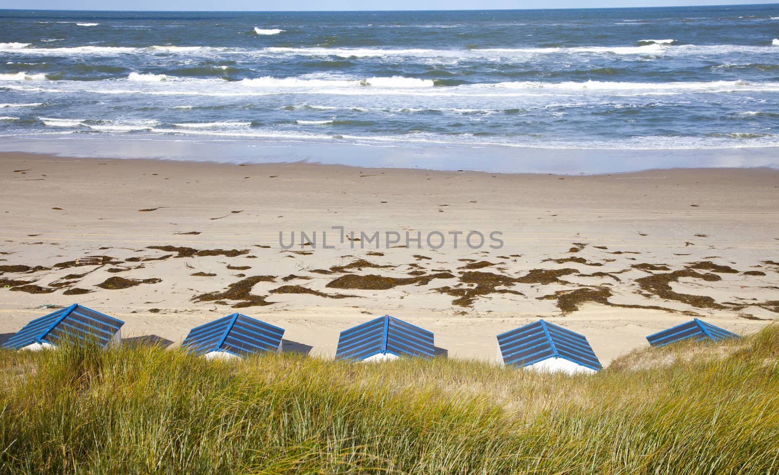Dutch little houses on beach in De Koog Texel, The Netherlands