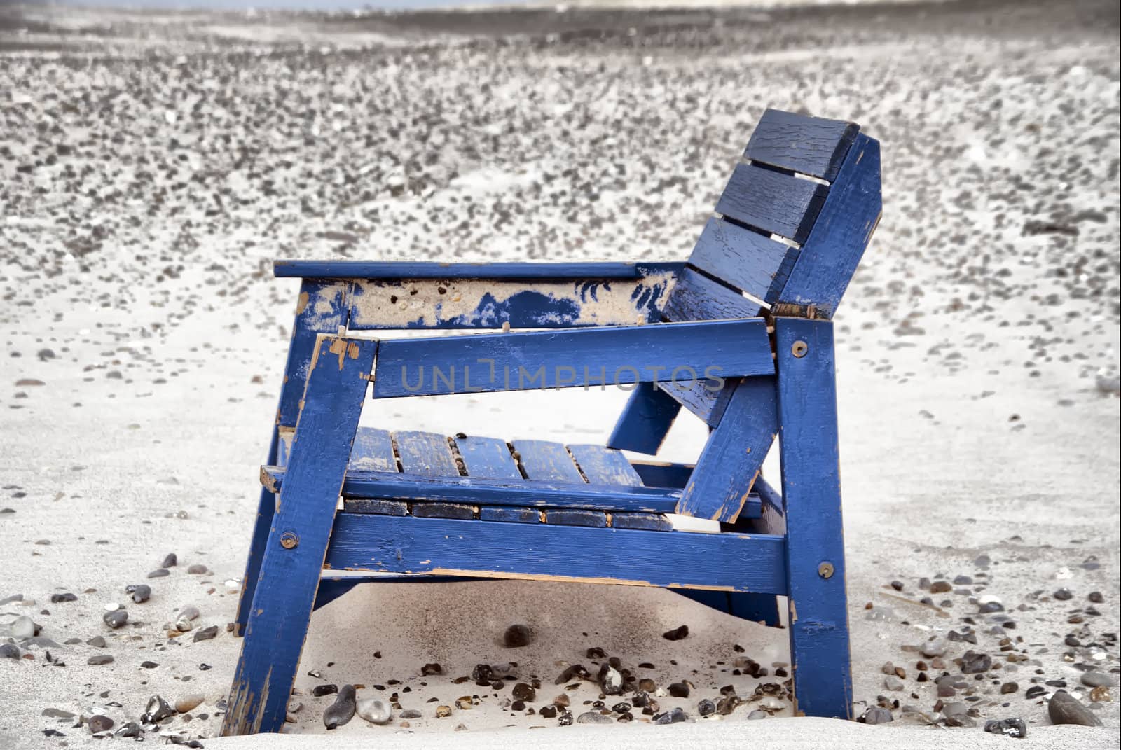 A stranded chair on the beach in denmark