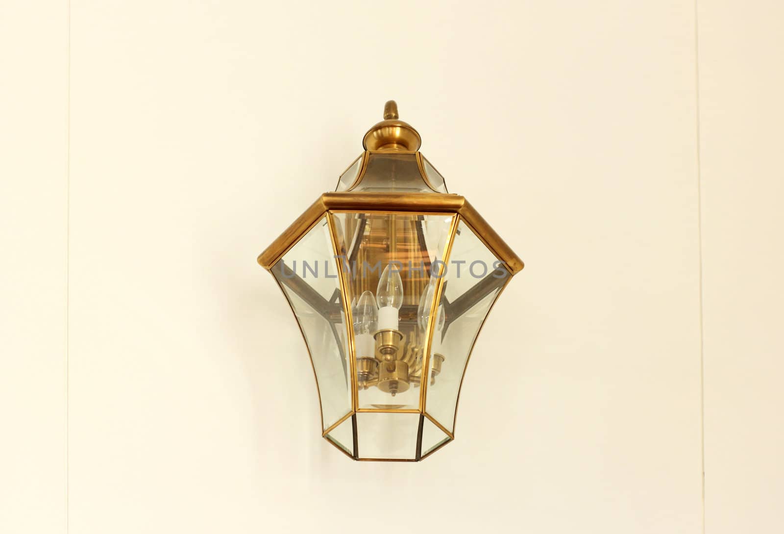 Vintage lamp on white wall by nuchylee