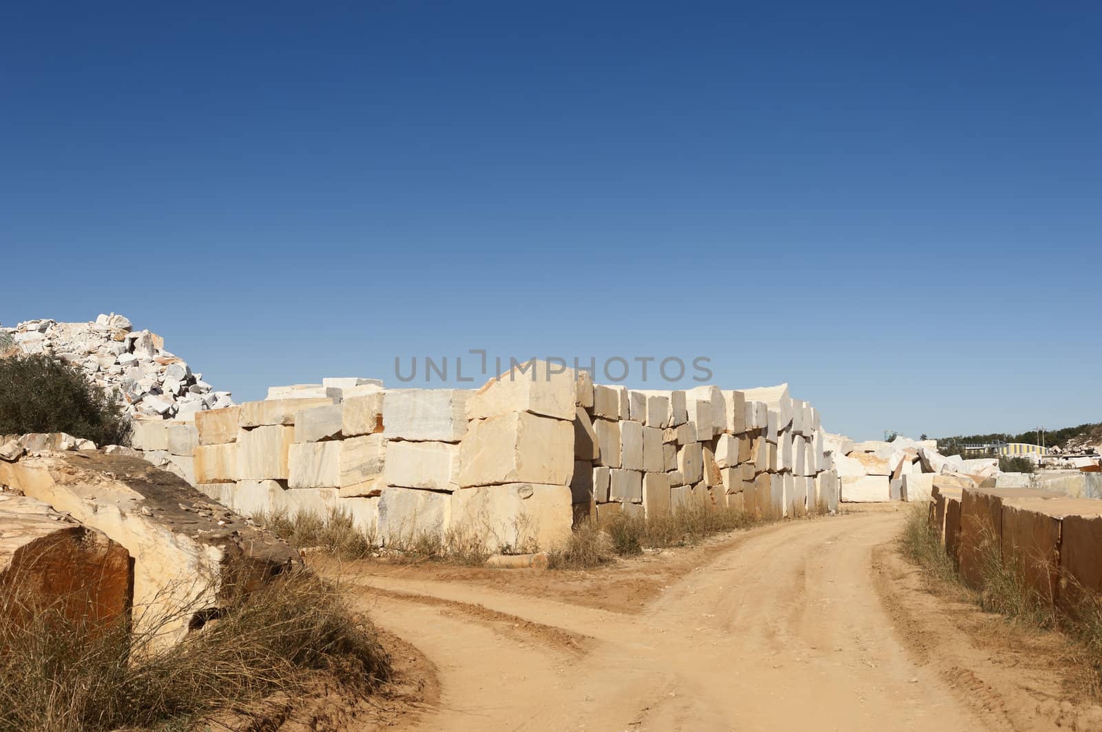 Marble blocks alongside a dirt road in the marble region of Borba, Alentejo, Portugal