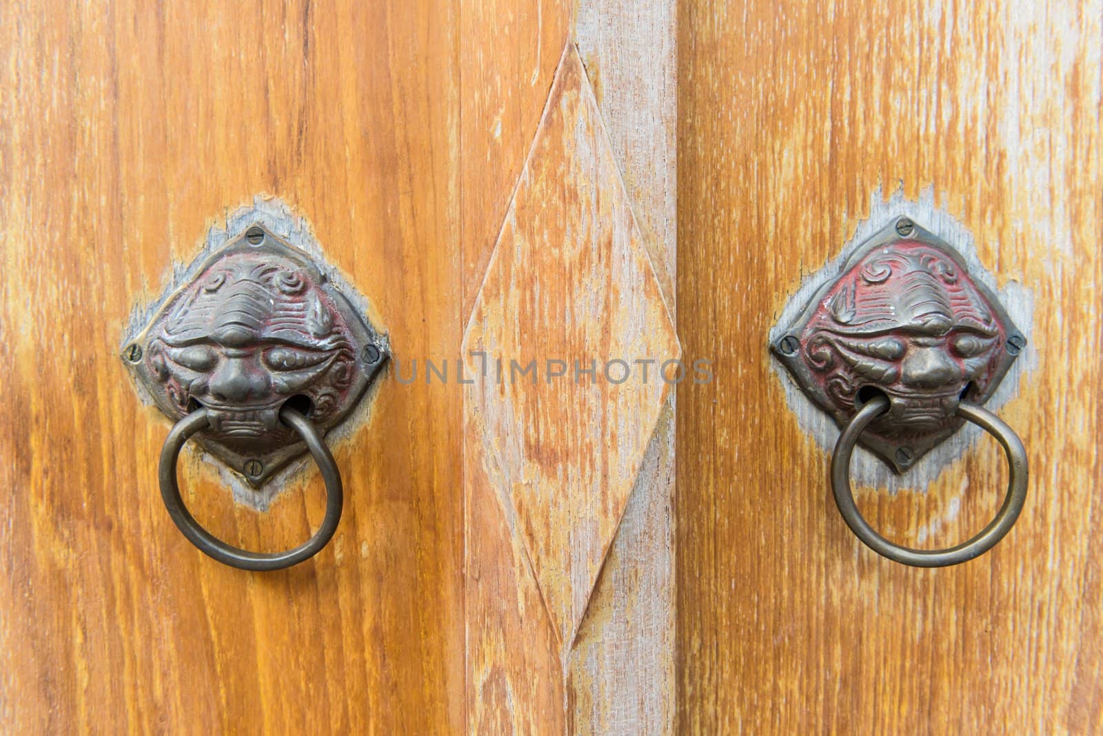 Old vintage chinese temple wooden door with metal chinese door handle