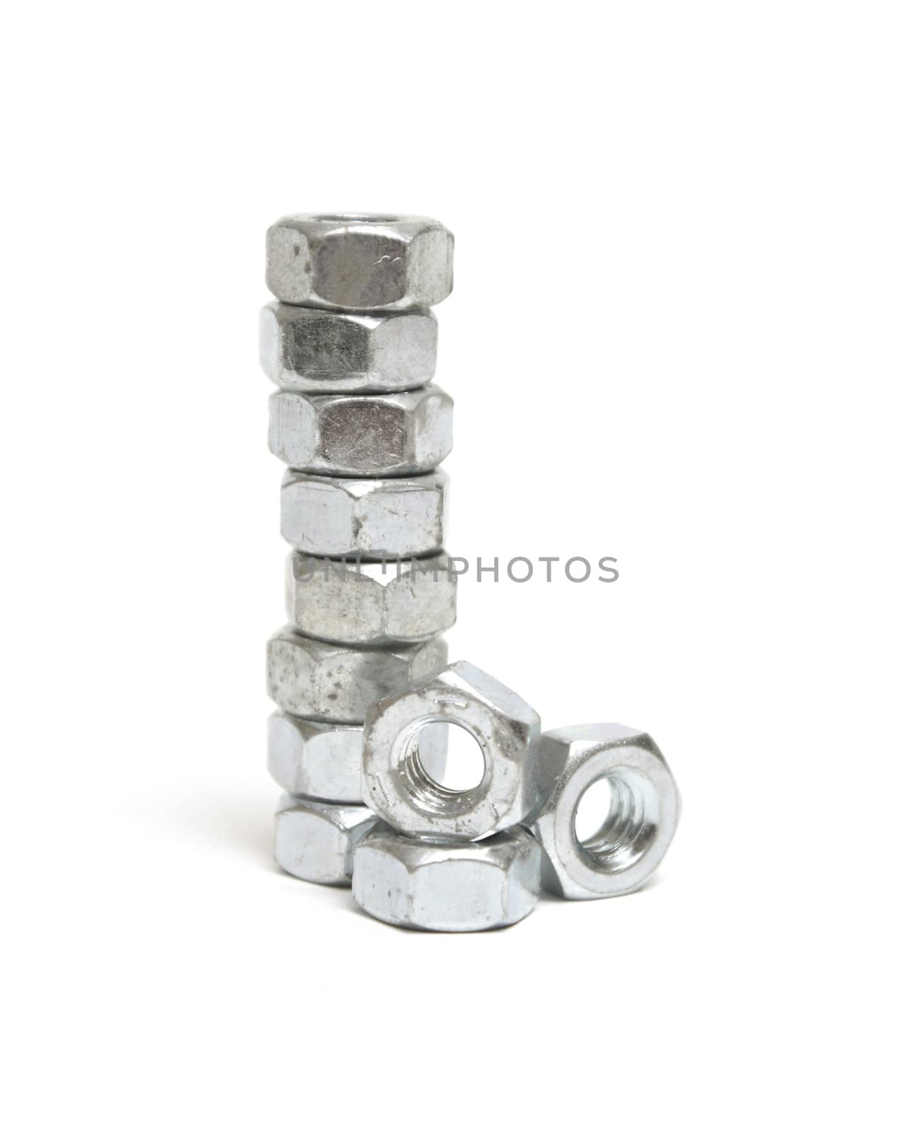 A stack of construction nuts isolated on white.