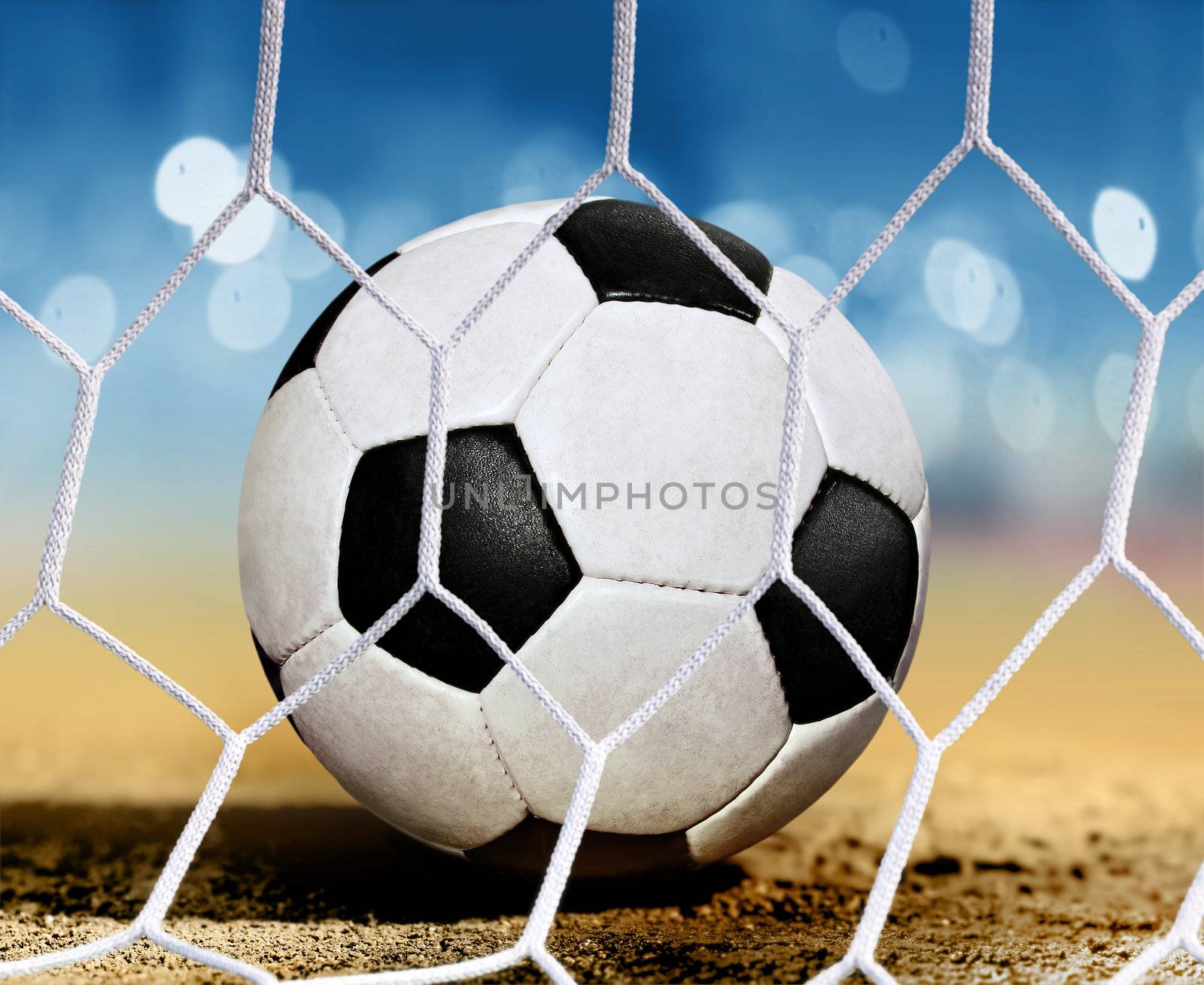 closeup soccer ball on ground near goal-area