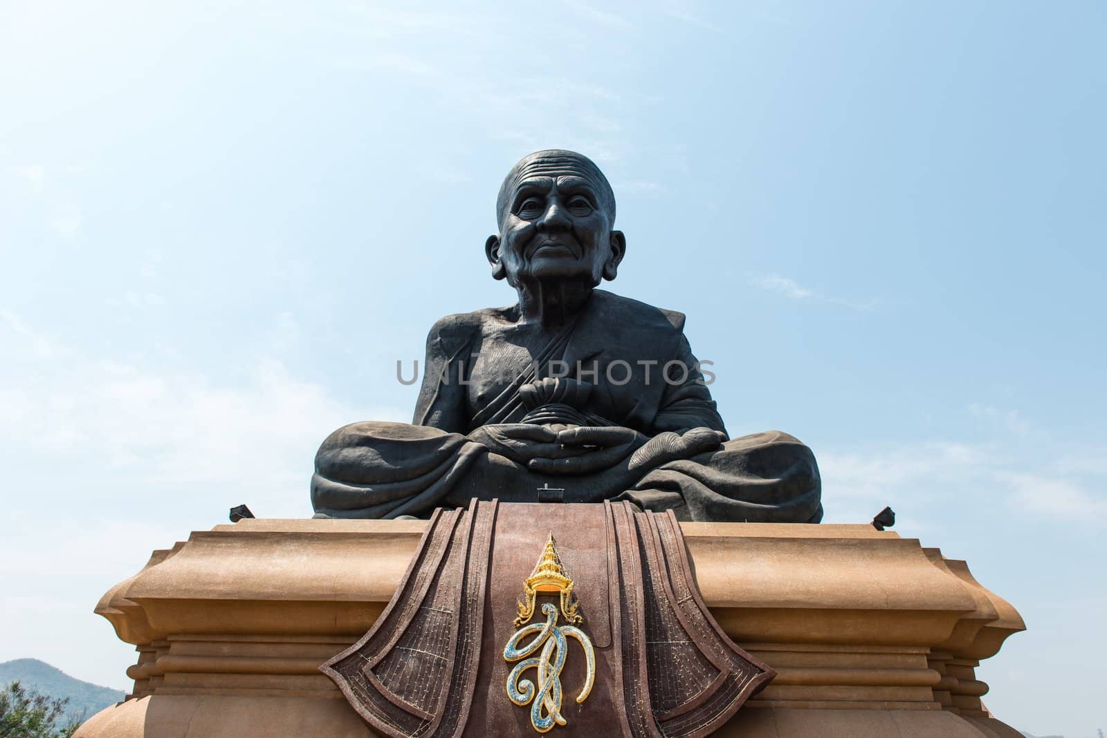 Large black great monk of thailand statue, taken on a sunny day