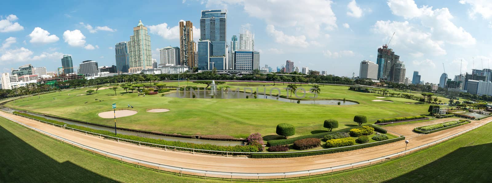 Golf course in the city of Bangkok taken in panoramic technic, on a sunny day
