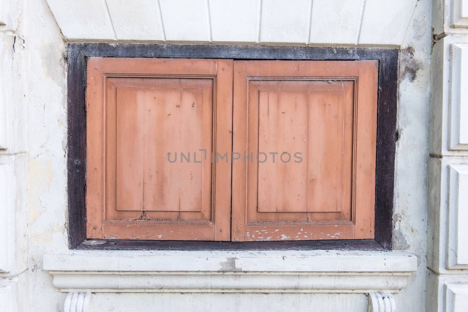 Very old vintage wooden traditional asian home windows, taken at front view