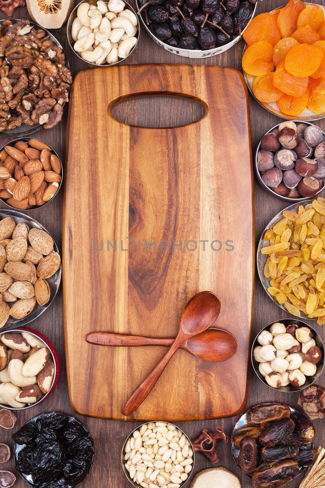 Wooden kitchen board surrounded by ingredients
