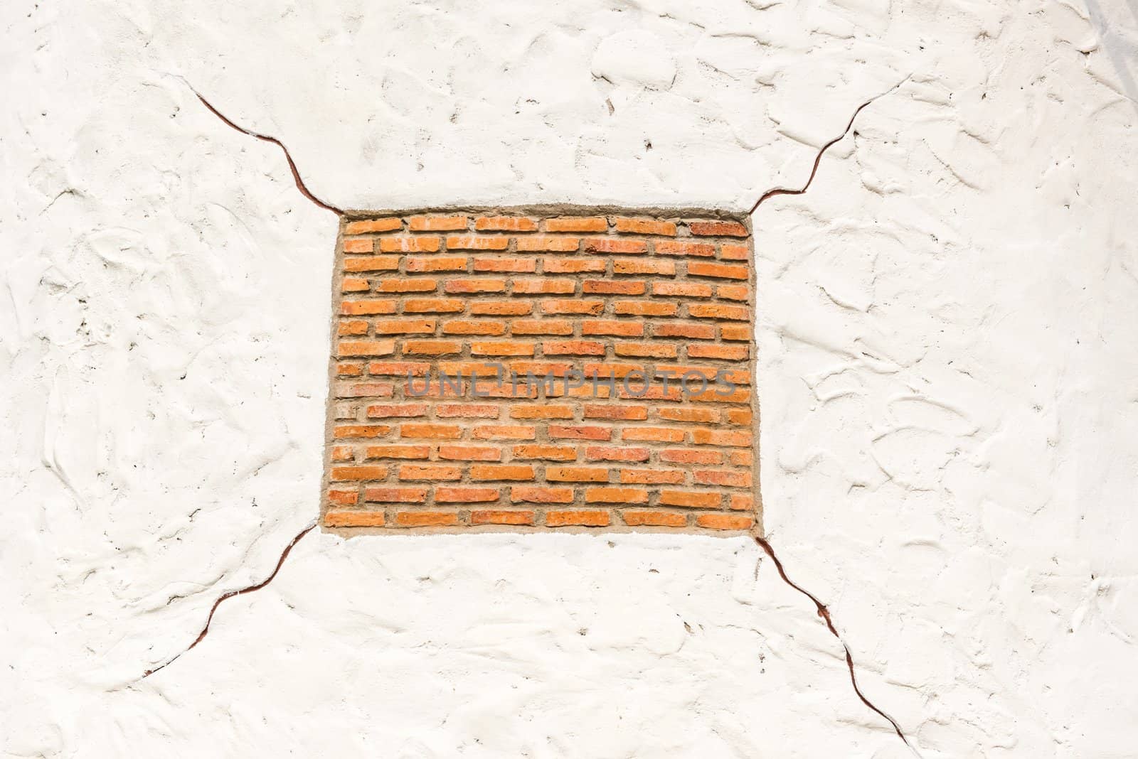 Red square shape brick on white background with cracks by sasilsolutions