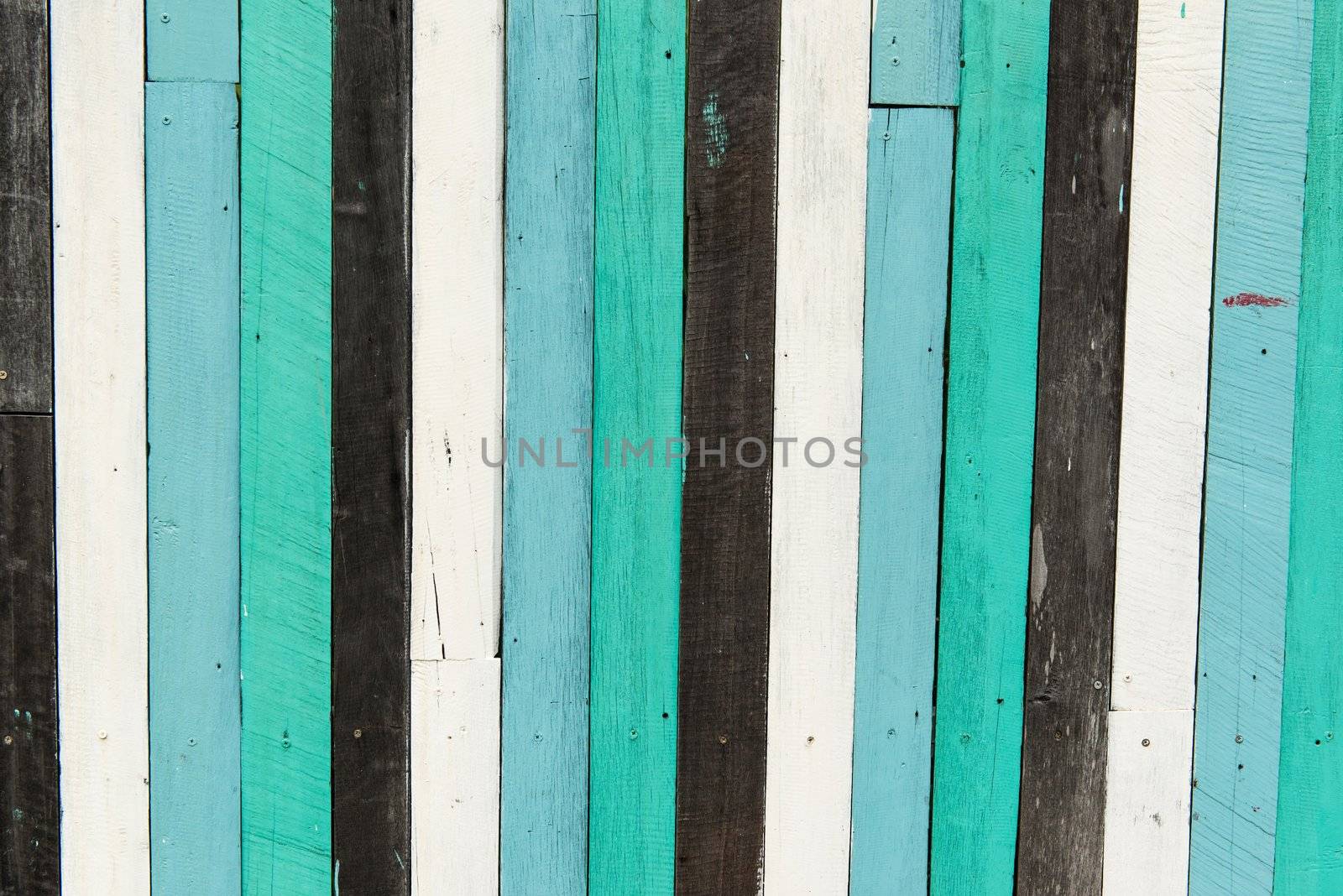 Blue, white, black contrasting old wooden texture background, taken on a sunny day