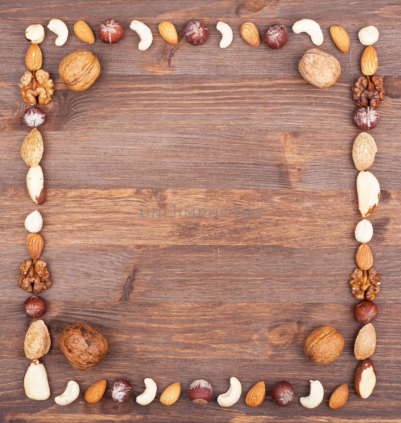 Square frame from different varieties of nuts