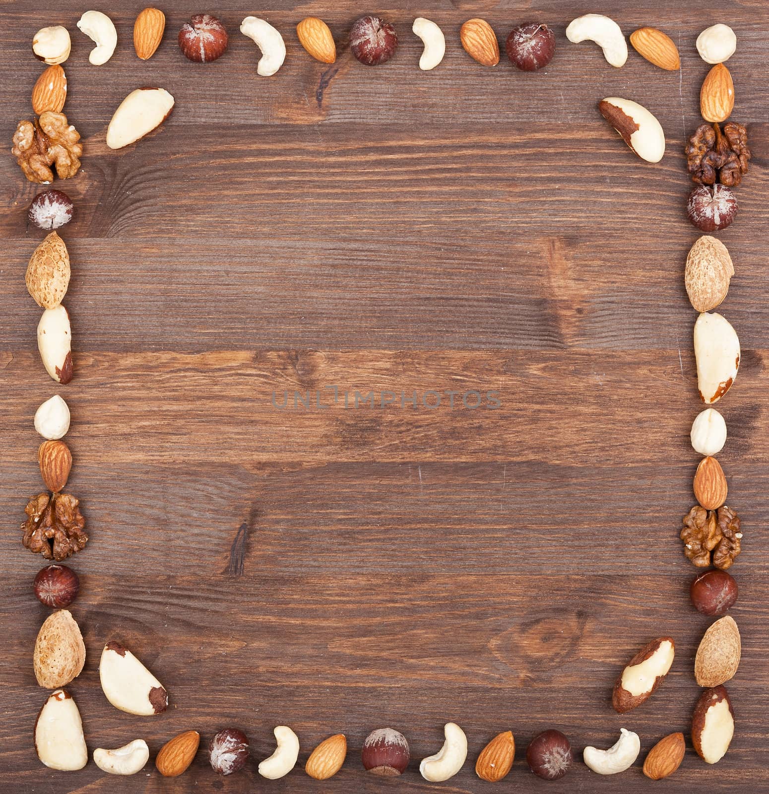 Square frame from different varieties of nuts