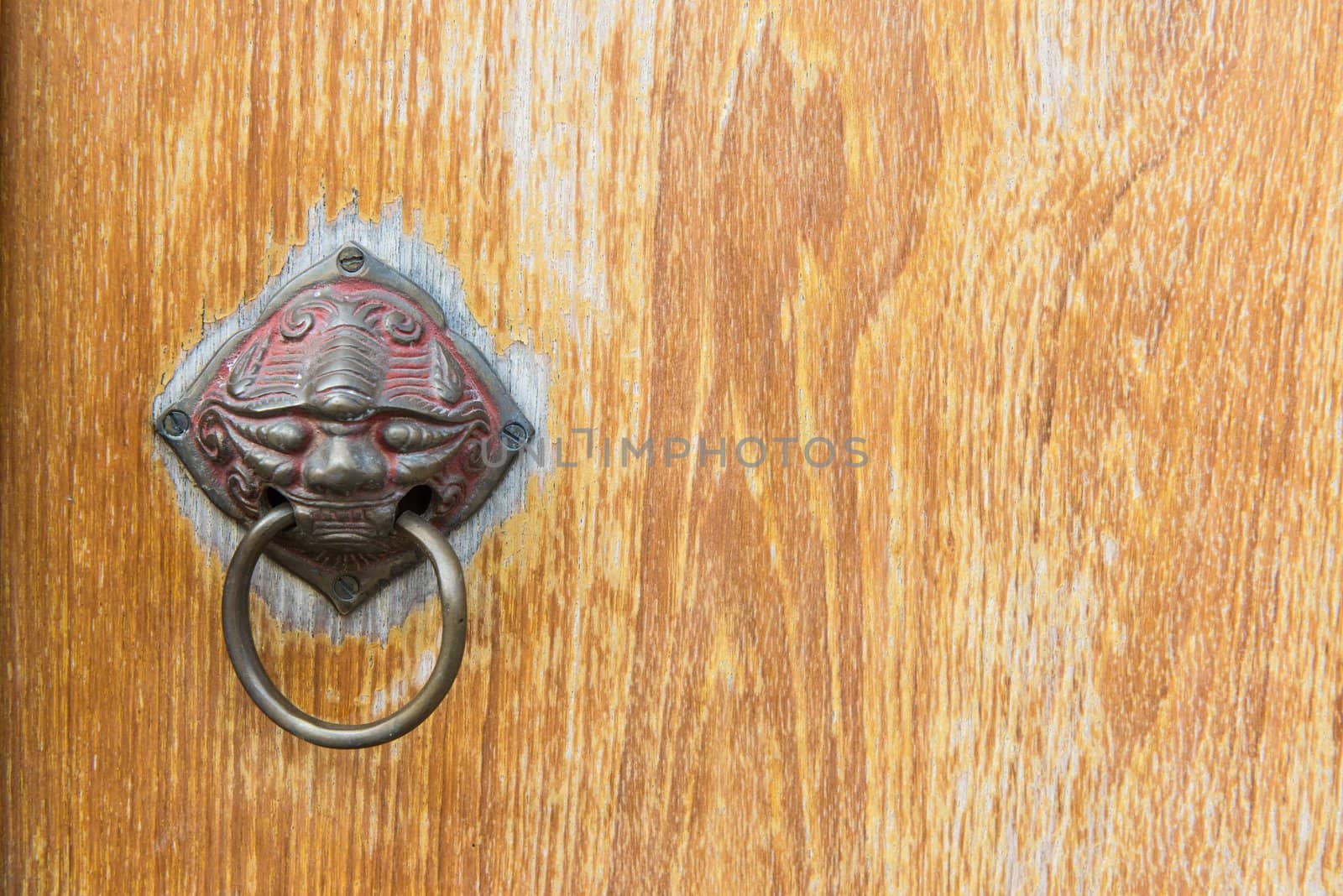 Old vintage chinese temple wooden door with metal chinese door handle