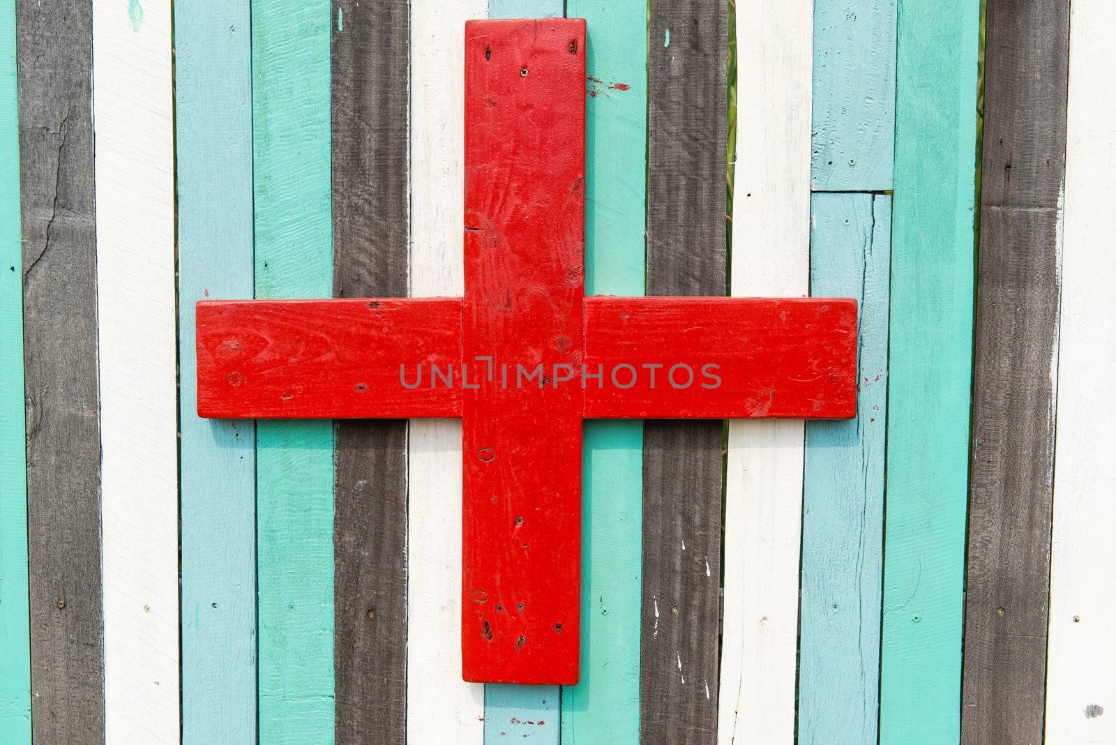 Blue, white, black contrasting old wooden texture background with plus sign, taken on a sunny day