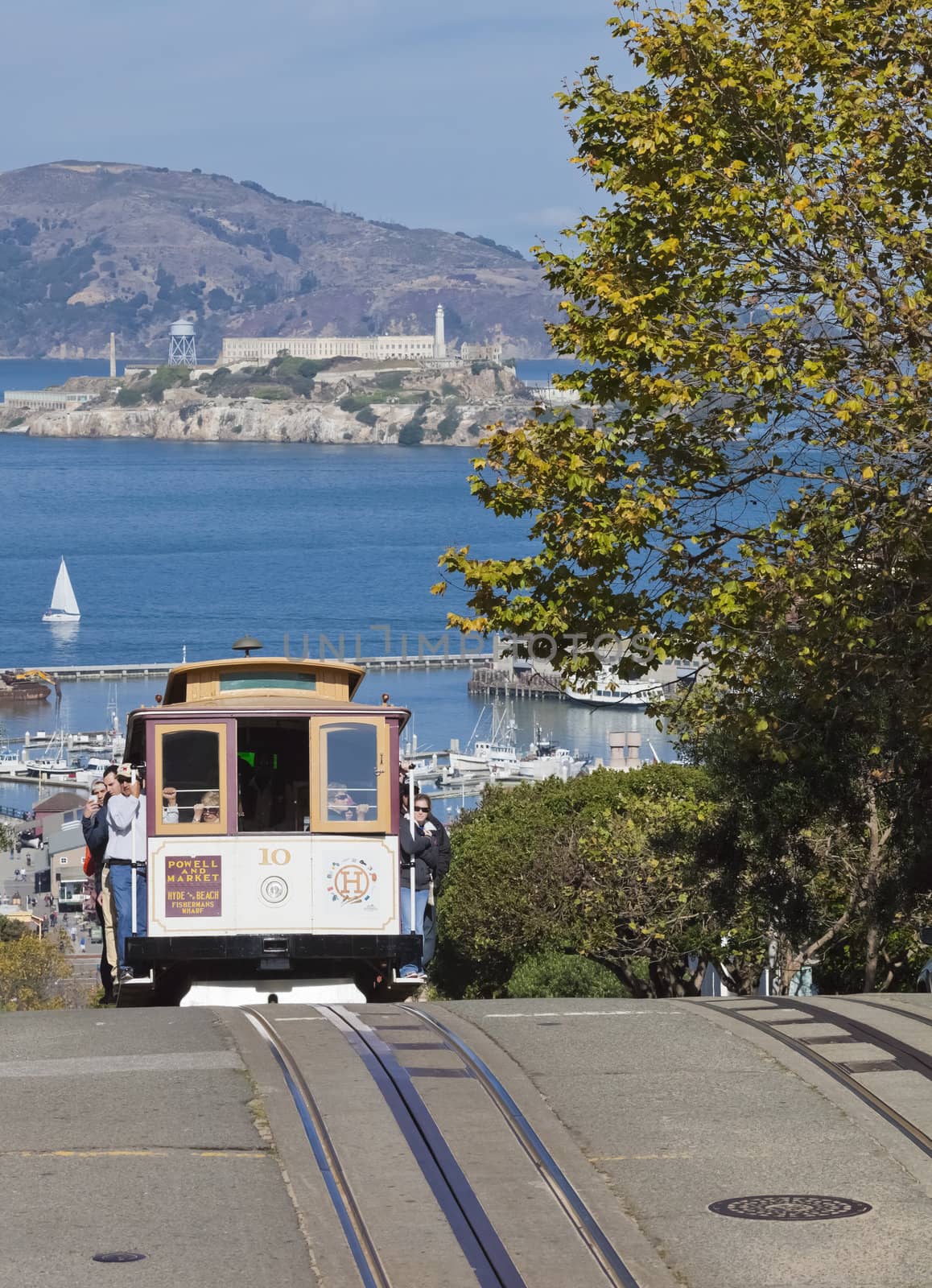 San Francisco-USA, November 2nd, 2012: The passengers are going from the station Hyde by the Cable car Tram to the Center of San Francisco. The Cable car is one of the San Francisco Attractions. Taken on Hyde street around 3pm, Nov 2nd, 2012.