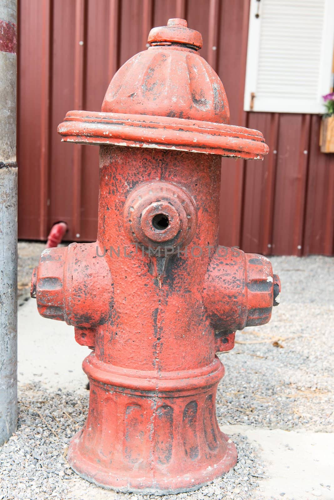 Rusty steel water pump outlet for fireman access, taken outdoor