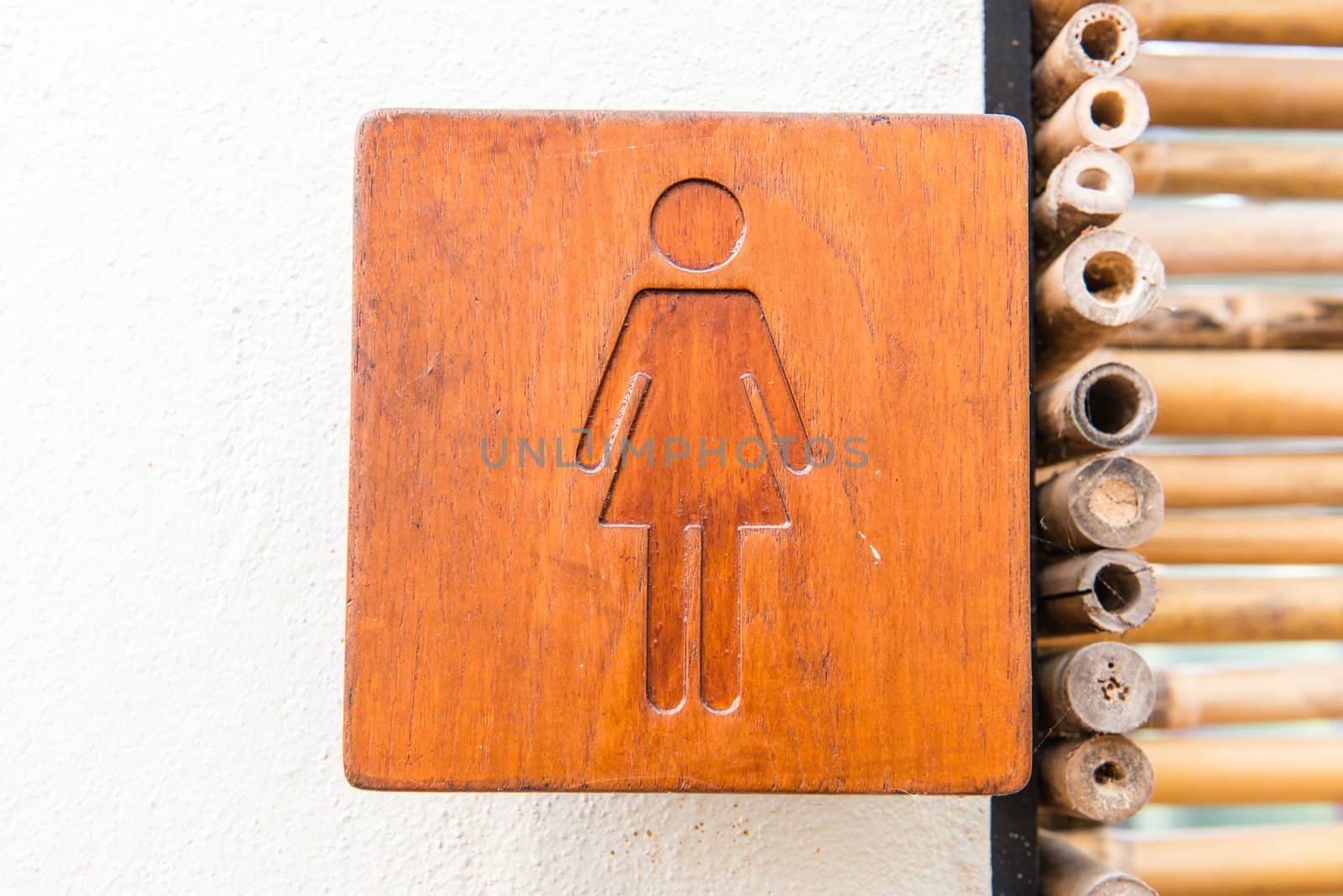 Brown hard wood polished toilet sign by sasilsolutions