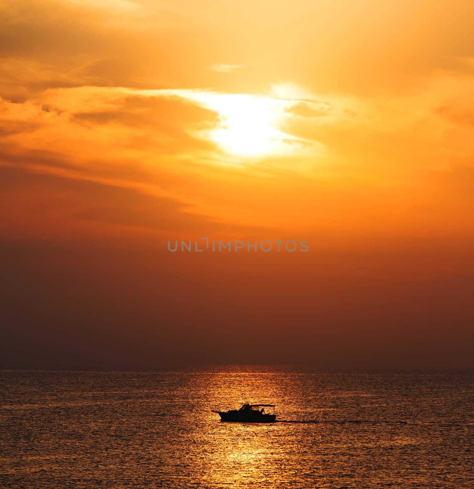 Silhouette Boat on the background of the sea sunrise