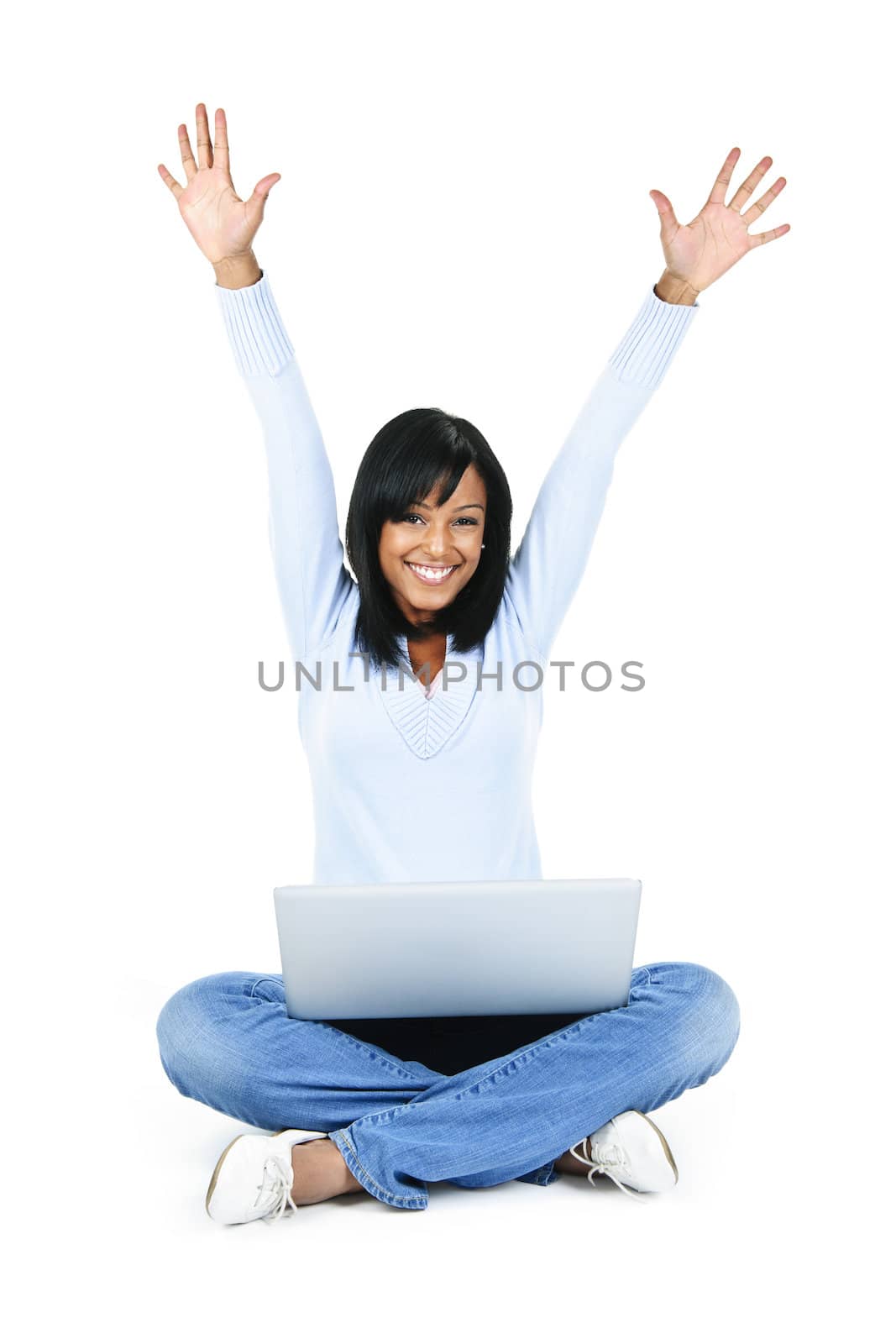 Happy woman with computer rasing arms by elenathewise