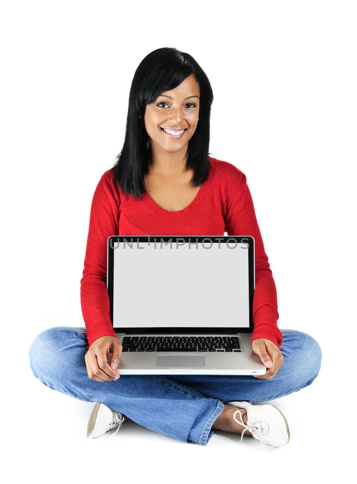 Black woman showing computer screen sitting and smiling