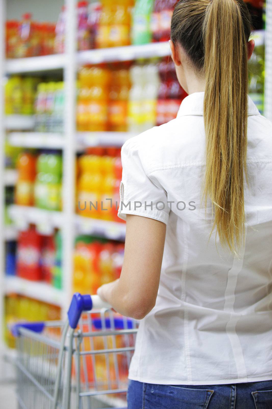 Woman with shopping cart, close up