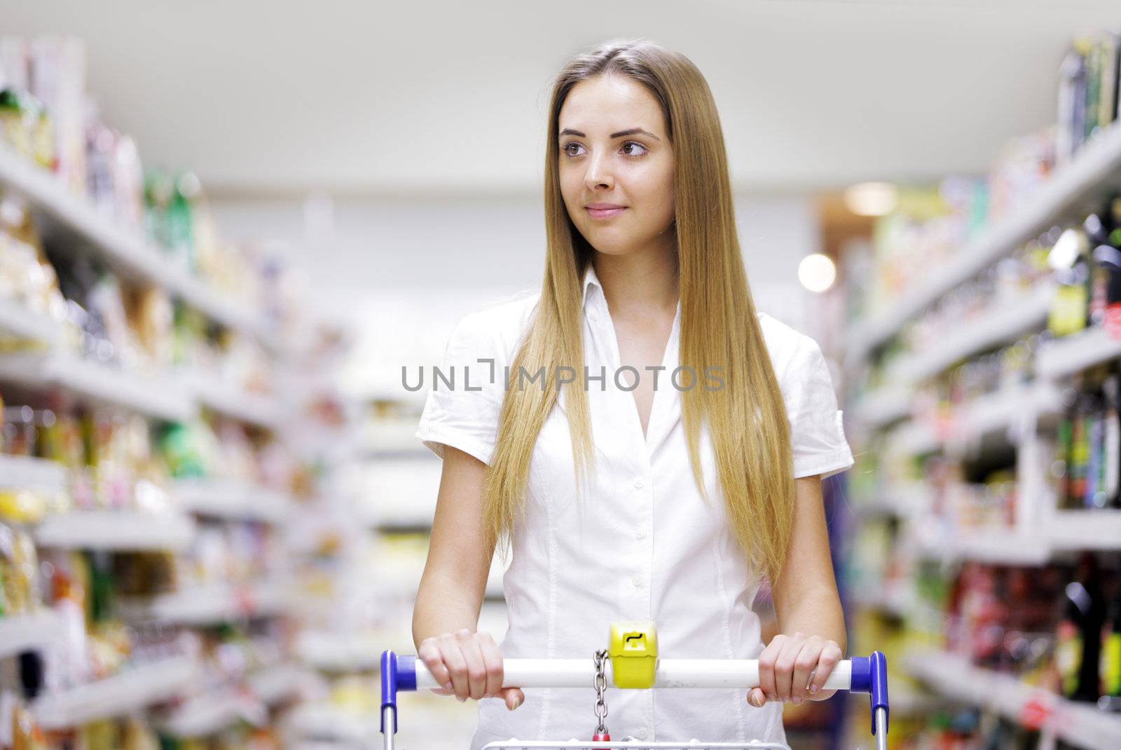 Young beautiful woman with shopping cart