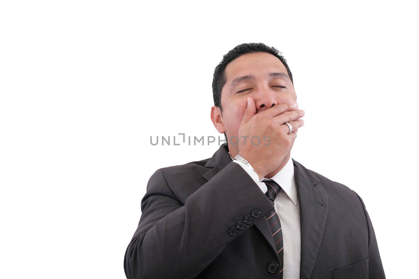 Exhausted sad businessman covering his mouth by hand