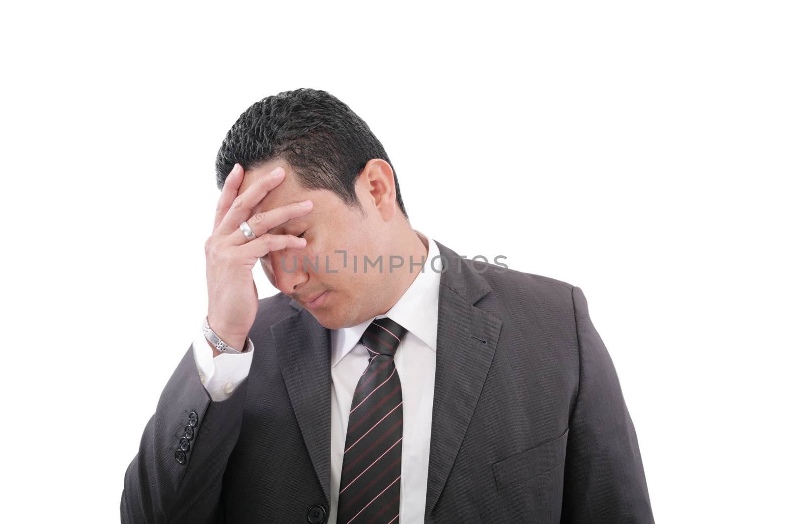 Closeup portrait of a pensive worried businessman with eyes closed in studio on isolated white background