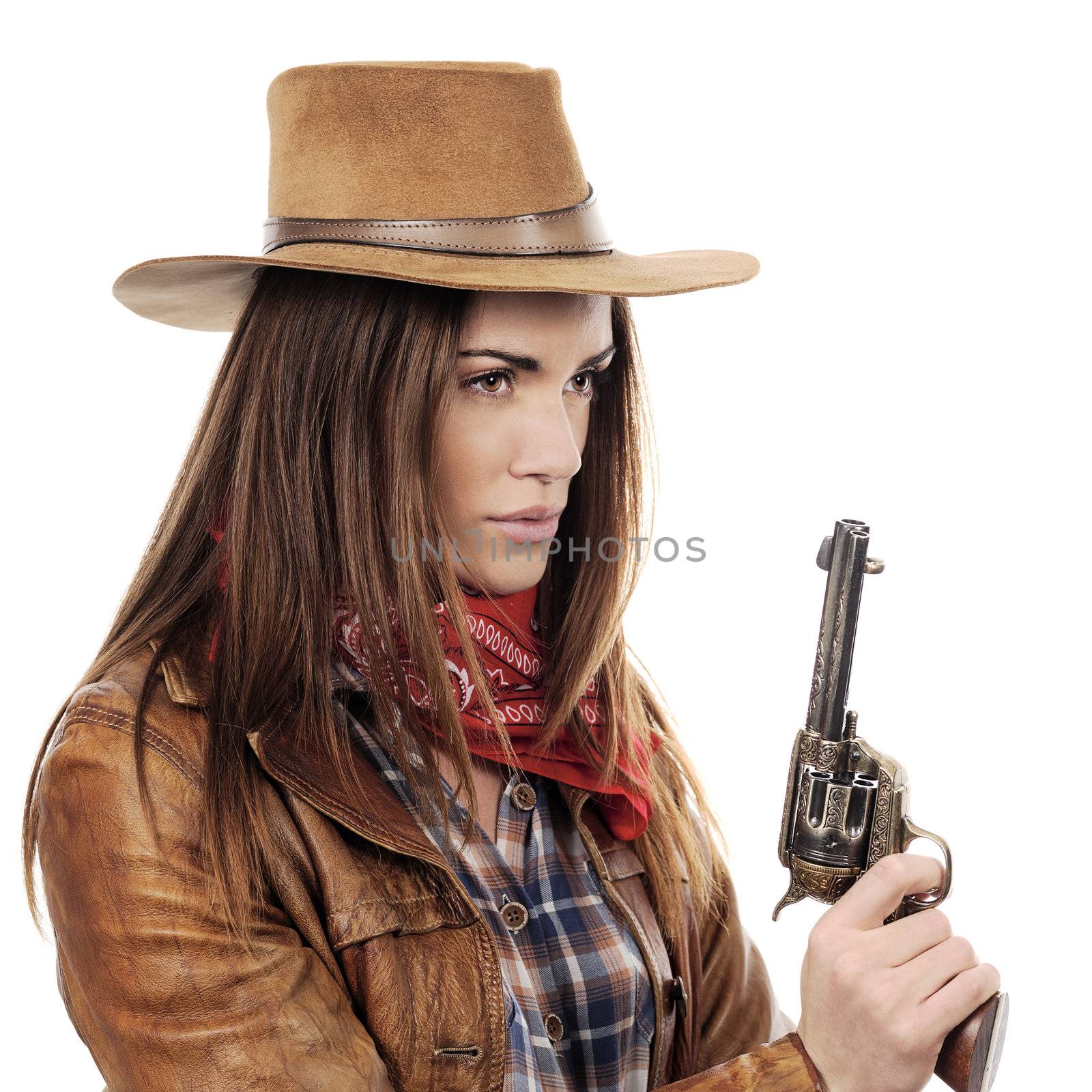 Beautiful cowgirl with gun on white background