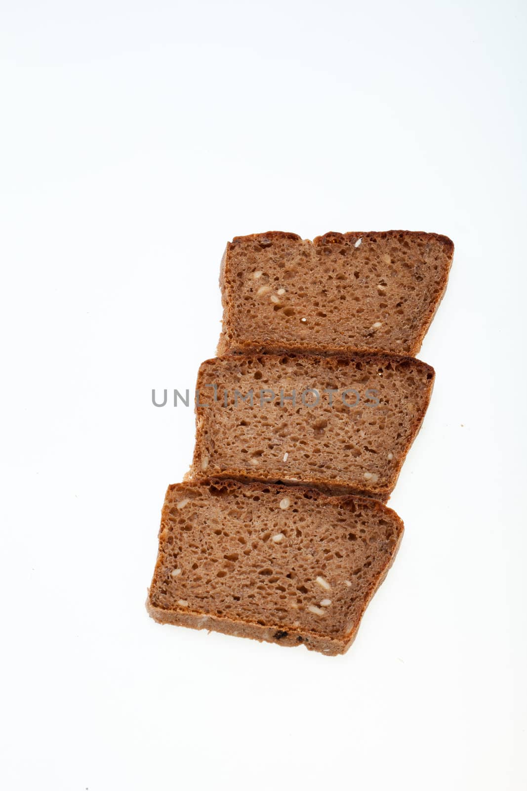 Slices of dark bread isolated over white 