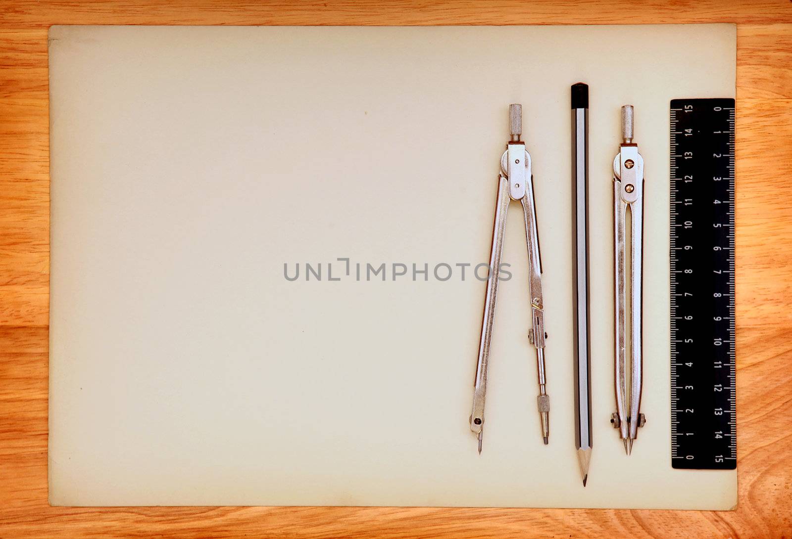 Blank Paper and Drawing Tools on the Wooden Background