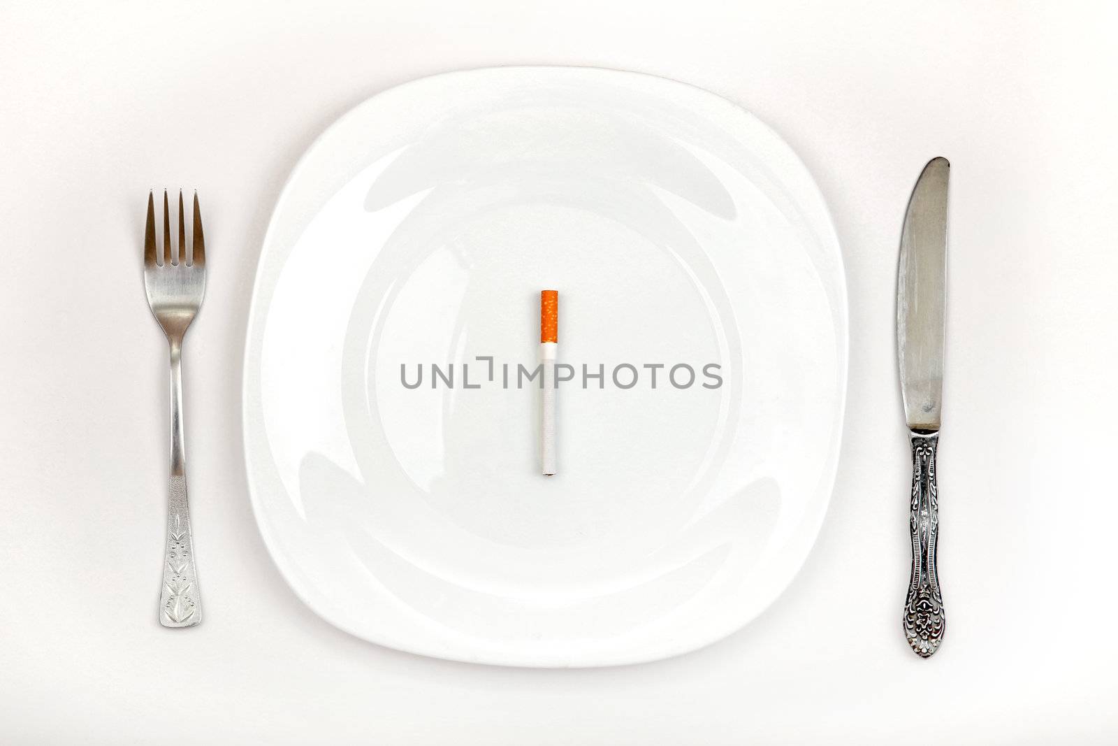 Cigarette On Dinner Plate by sabphoto