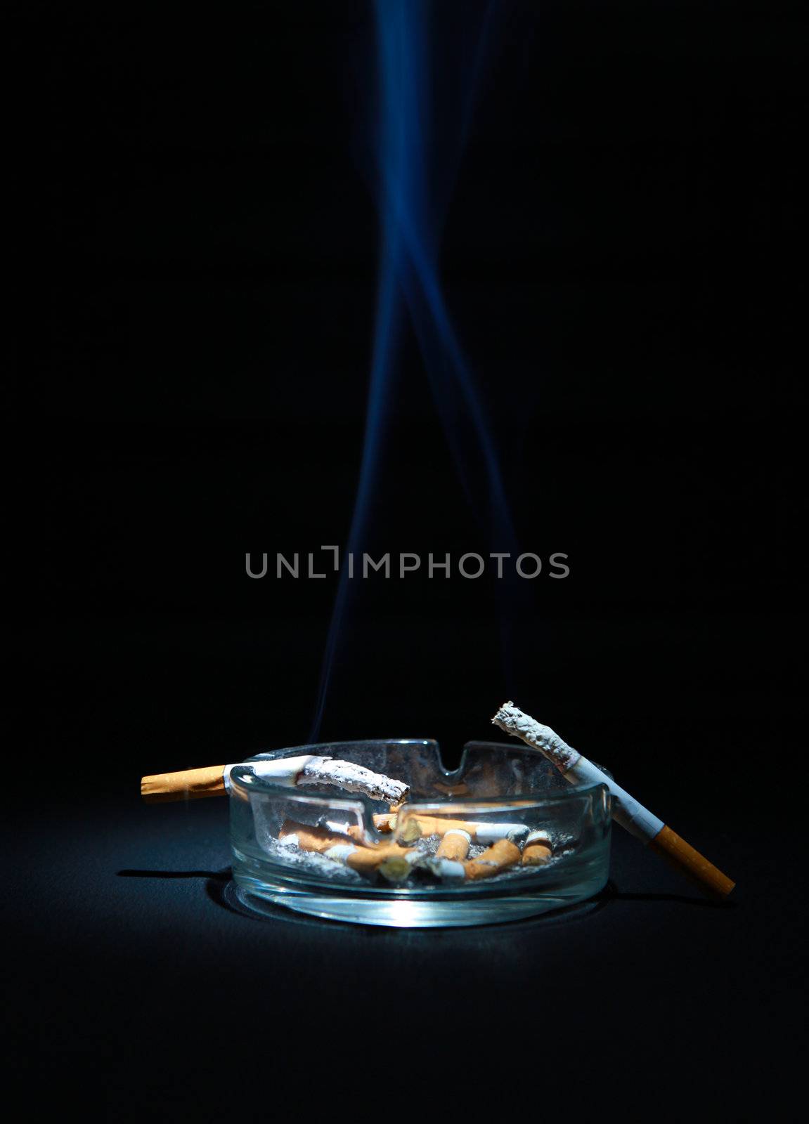 Ashtray And Two Cigarette by sabphoto