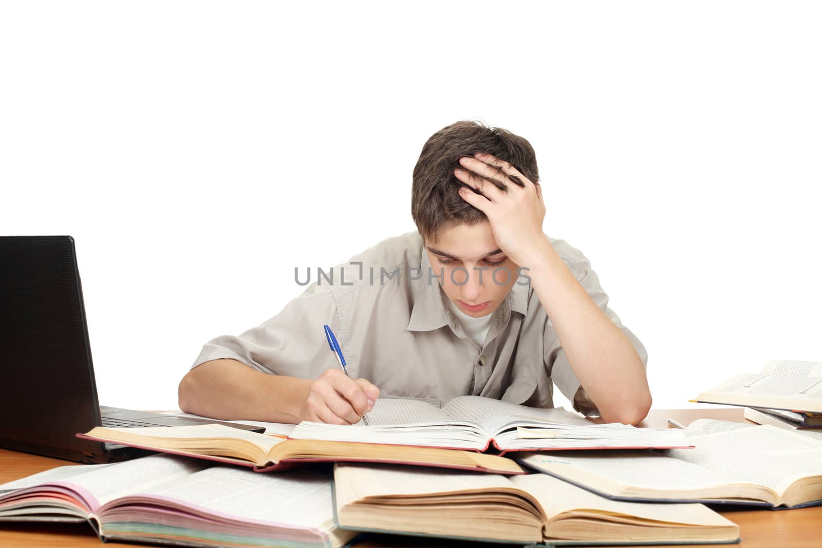 Student on the School Desk is Writing