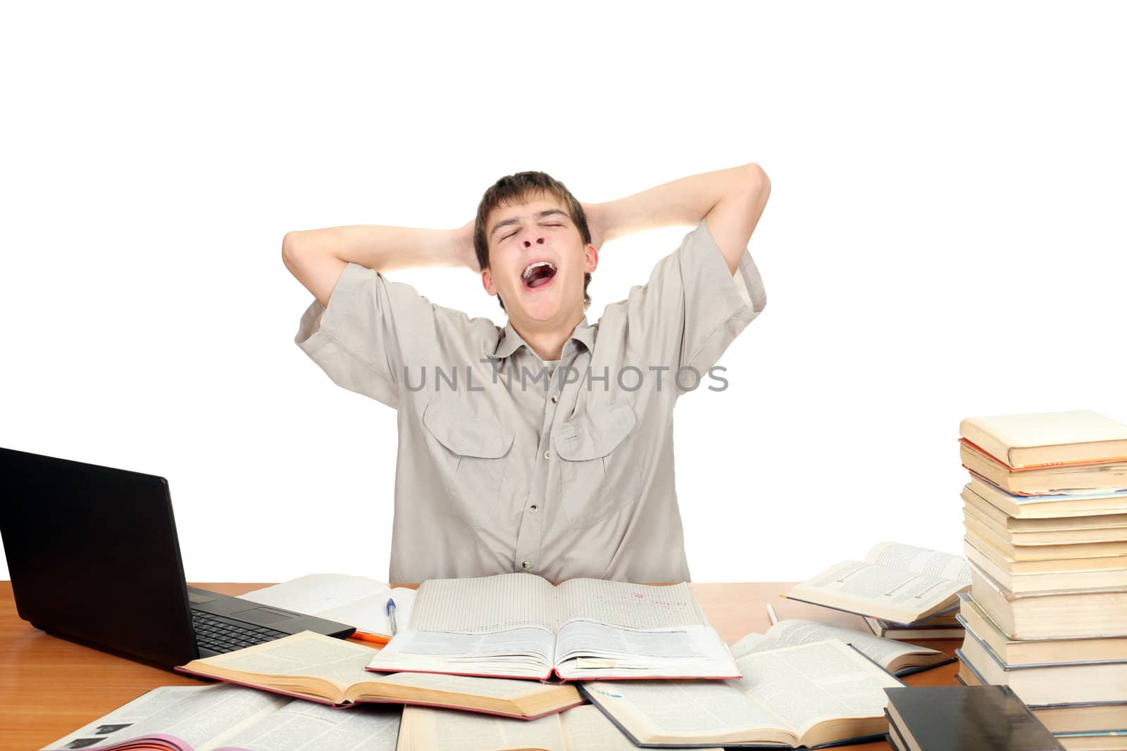 Tired Student Yawning on the School Desk. Isolated on the White