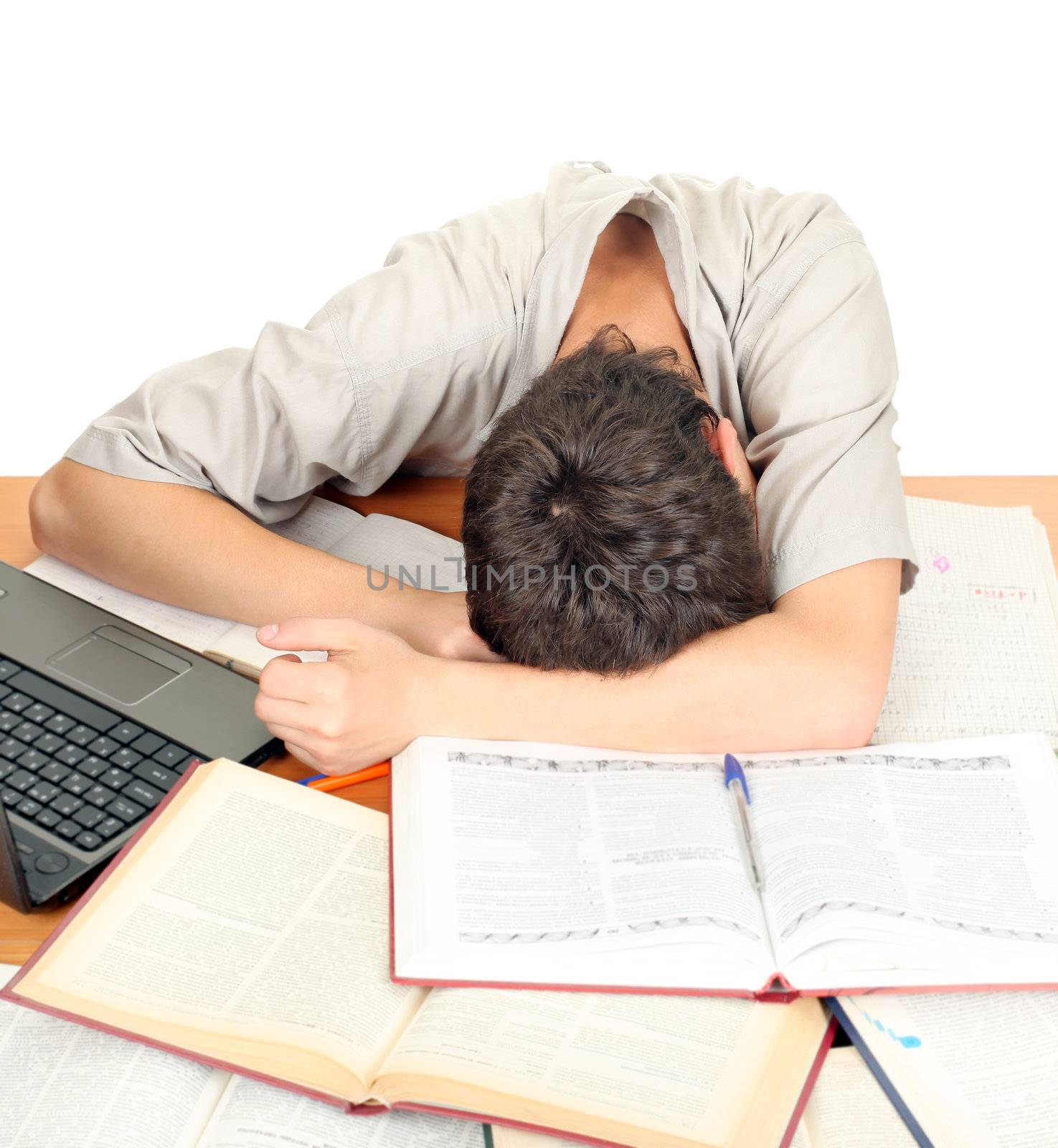 Tired Student sleeping on the School Desk. Isolated on the White Background