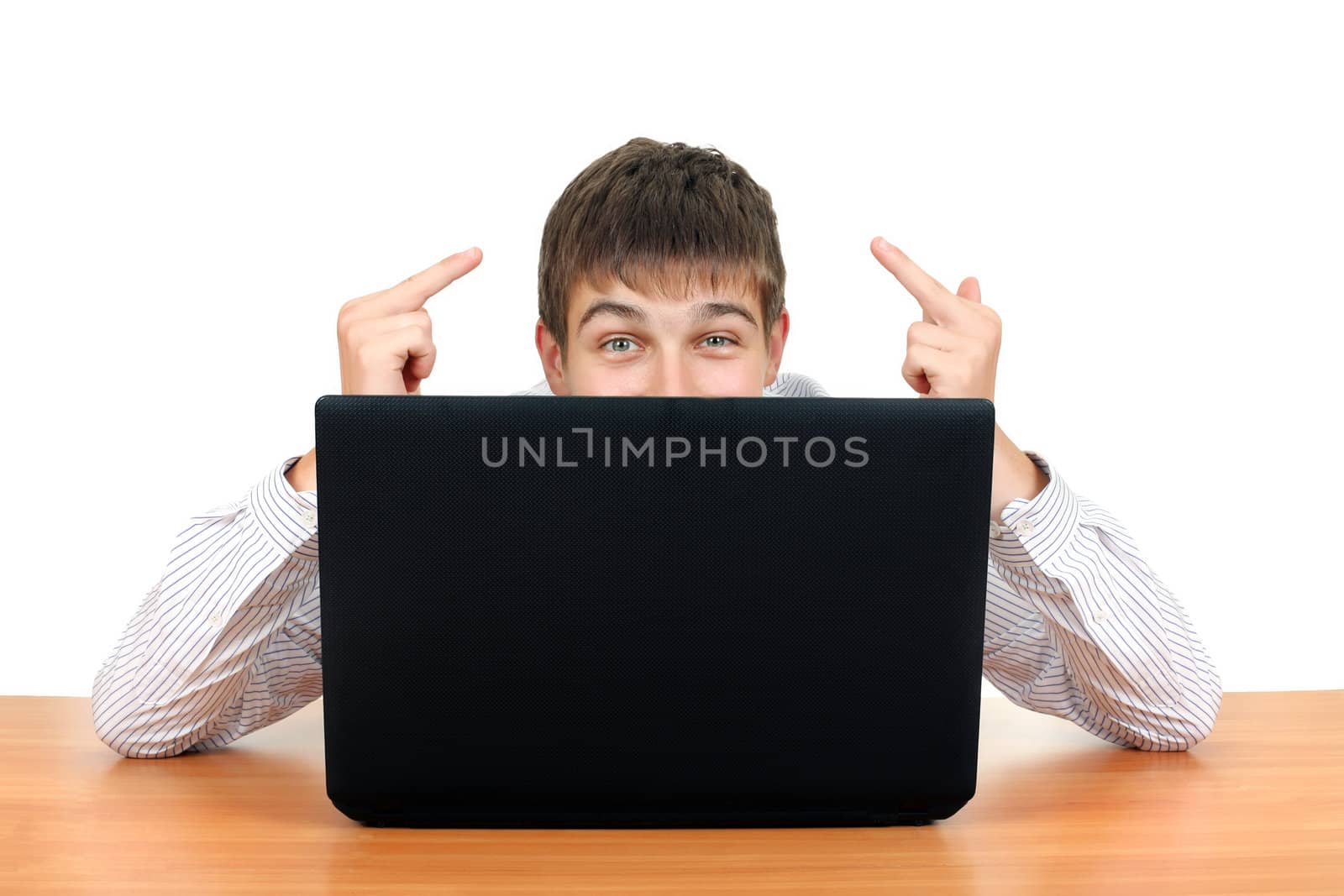 Young Man Shows Middle Fingers Gesture behind Laptop. Isolated on the White Background