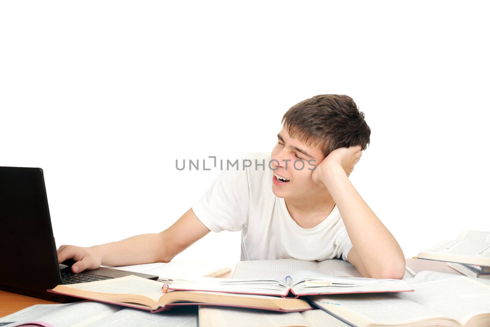 Tired Student Yawning on the School Desk. Isolated on the White