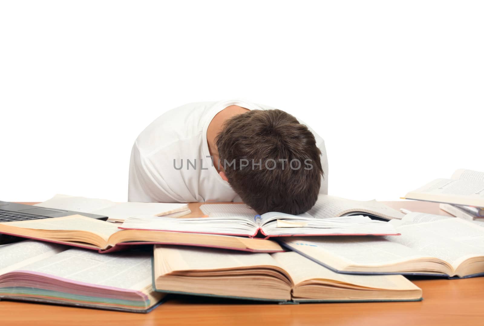 Tired Teenager lying and sleeping on the School Desk. Isolated On the White Background