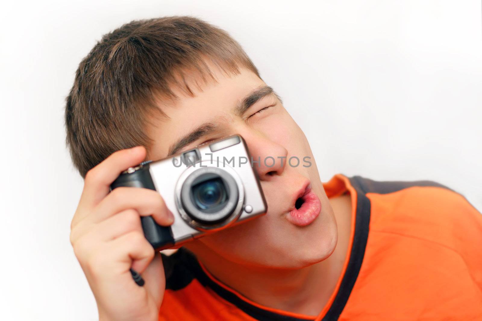 Excited Teenager with Photocamera gets ready to take a photograph