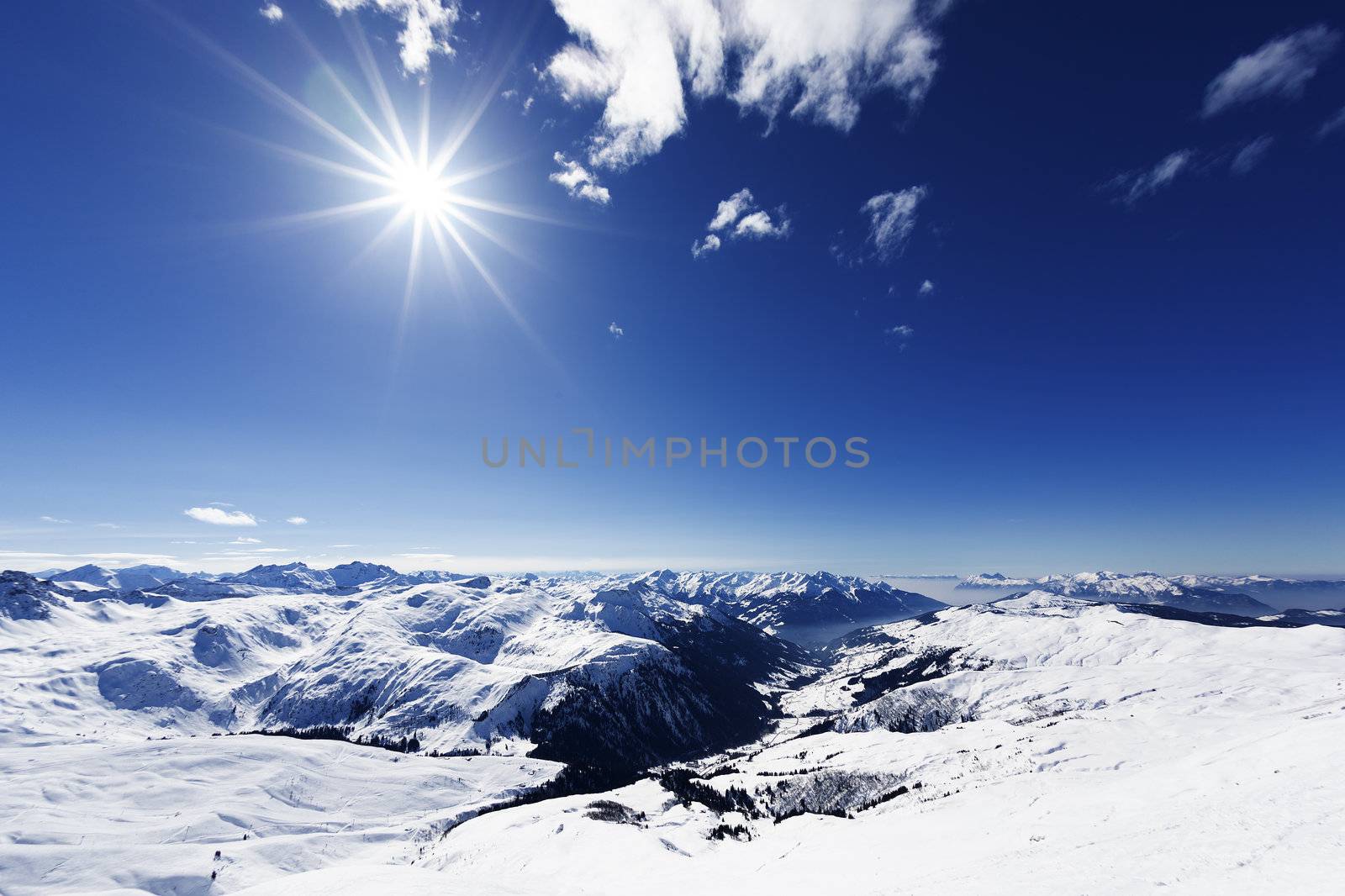 View down on typical Alpine ski resort and ski slopes