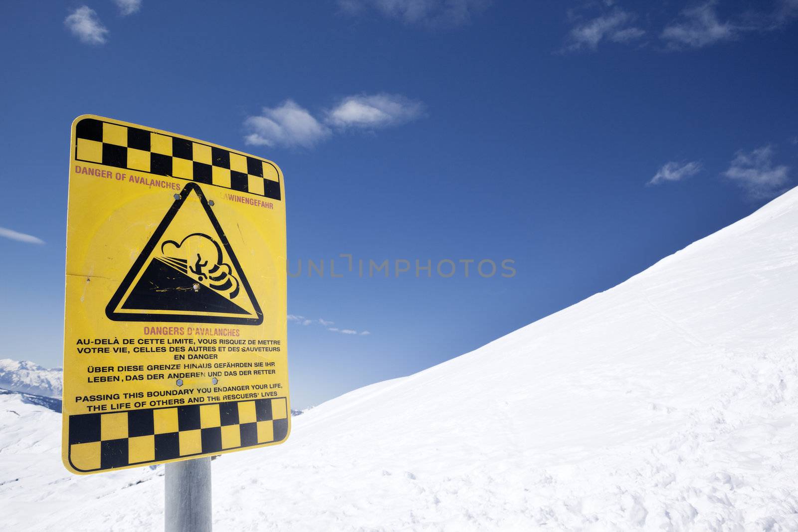 Snow ski resort caution sign on mountain