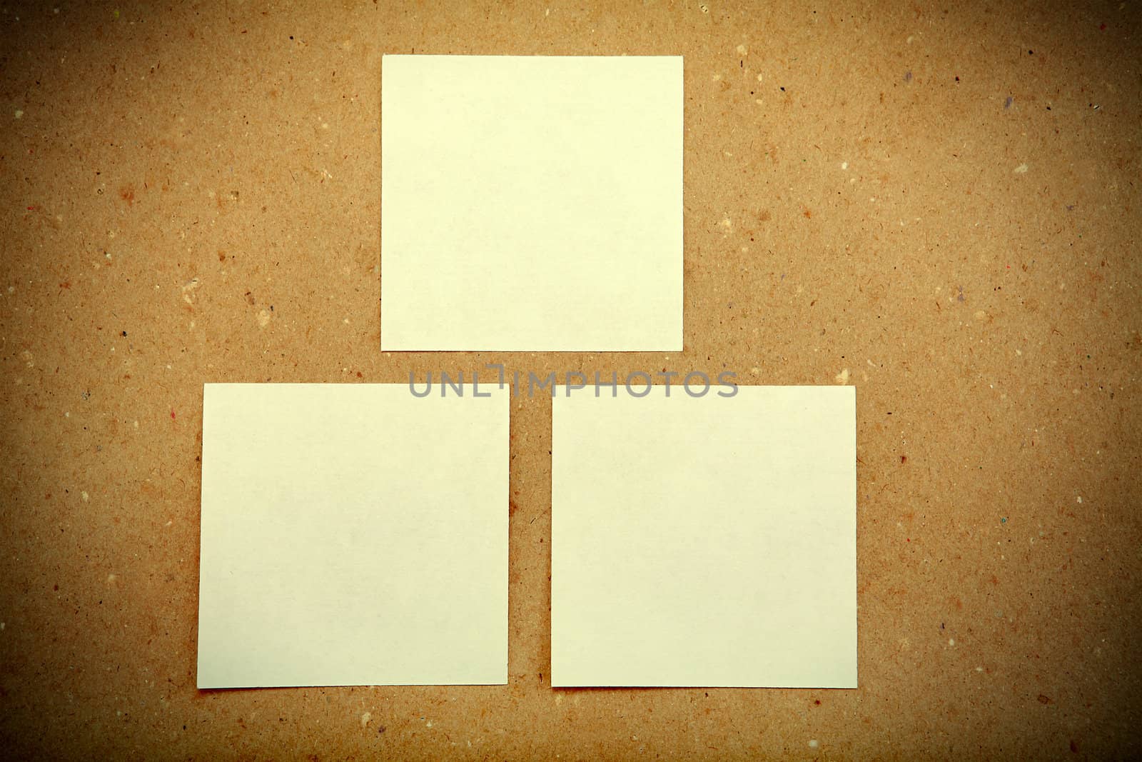 Notice Board with empty papers on old wooden wall background