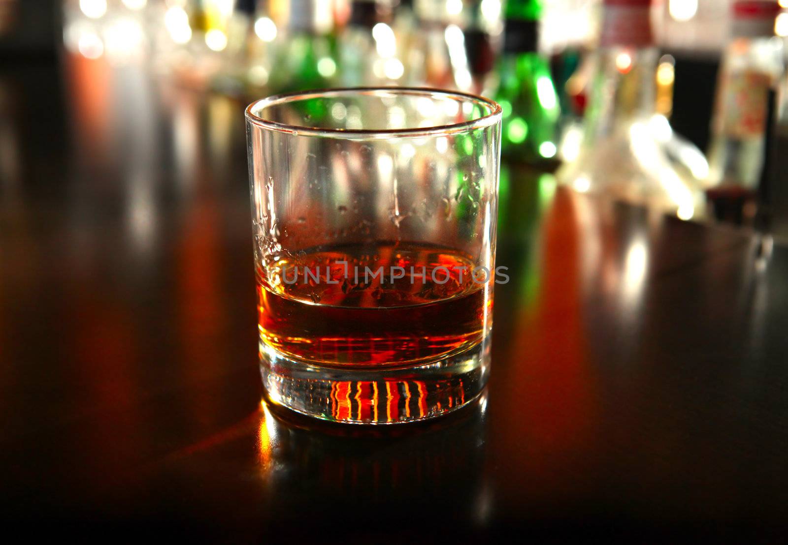 Glass Of Whiskey on the Bar counter Closeup