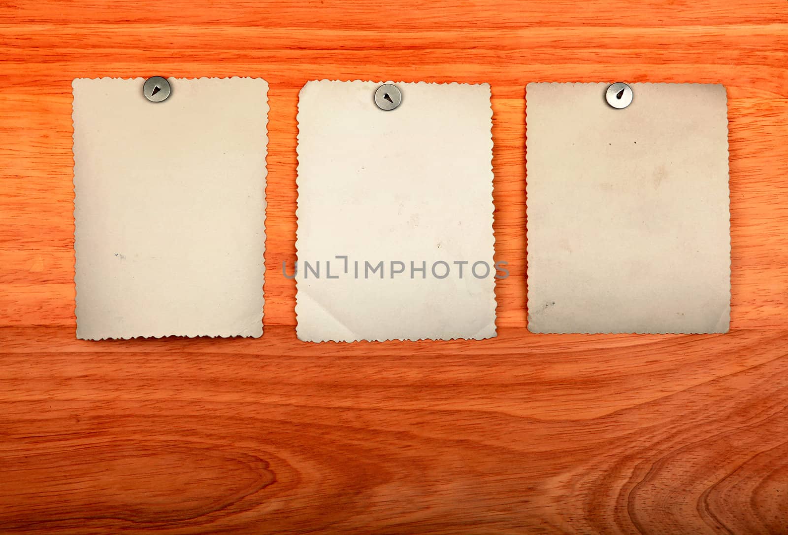 Notice Board with empty papers on old wooden wall background