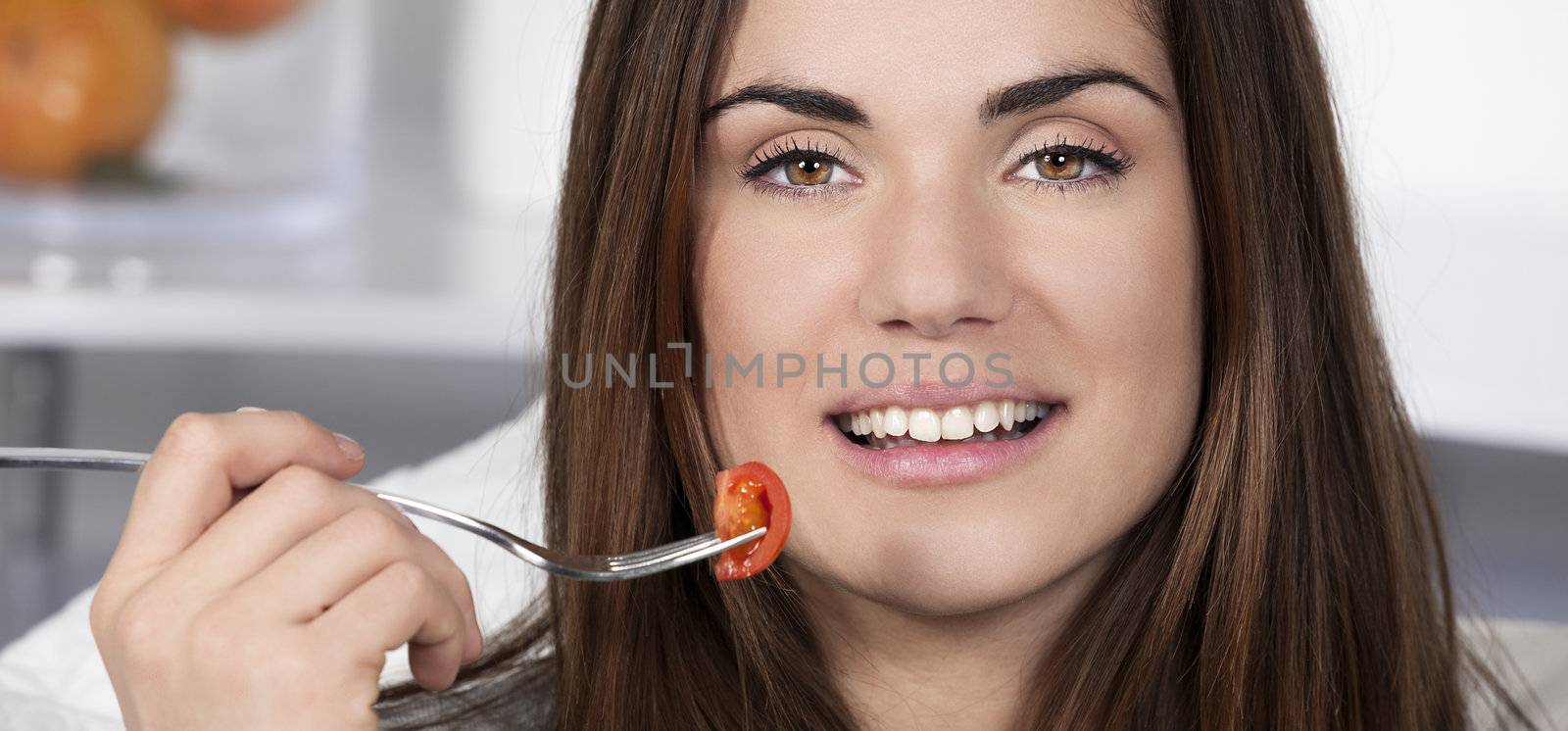 girl eating healthy tomato by vwalakte