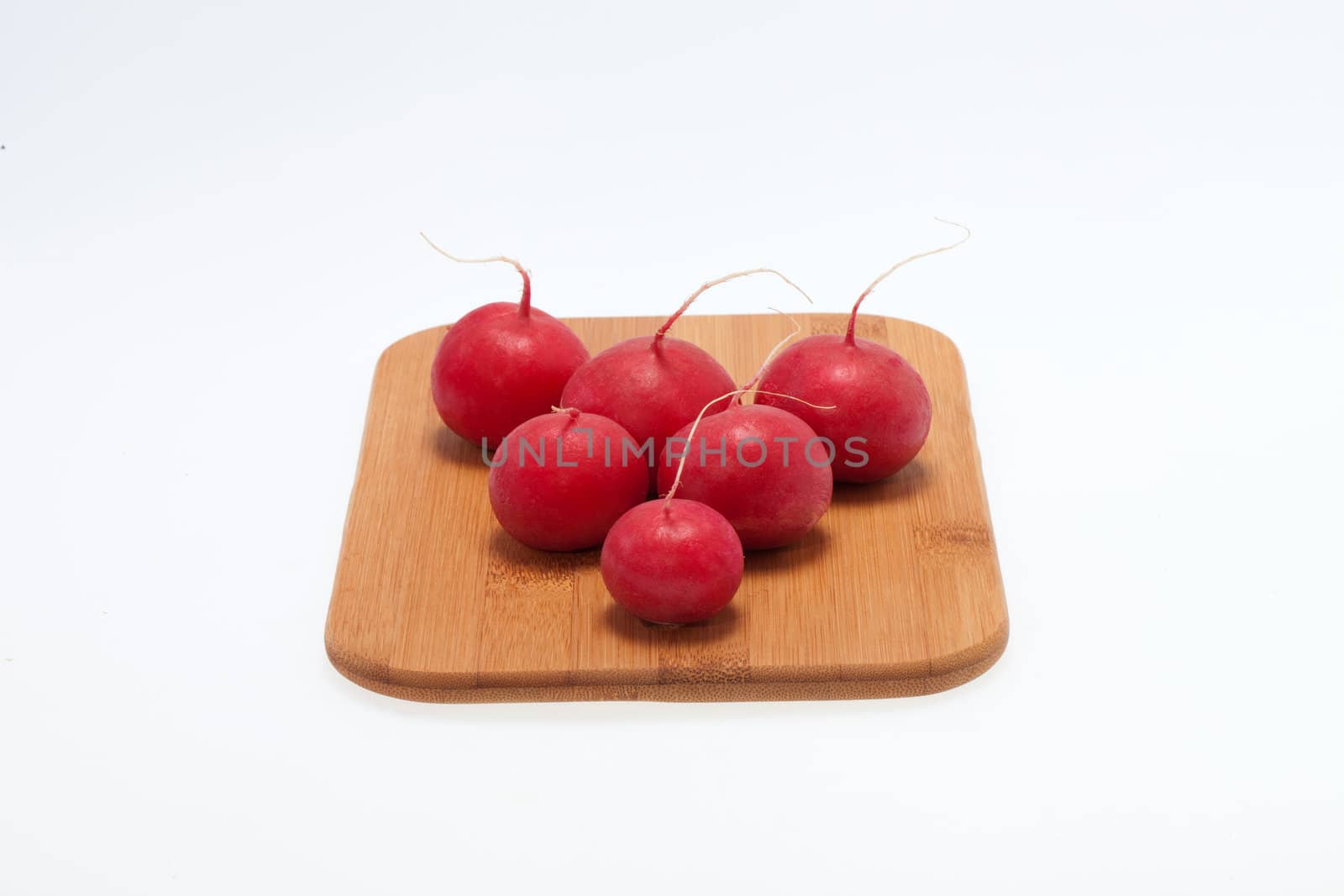 Garden radish on wooden board 