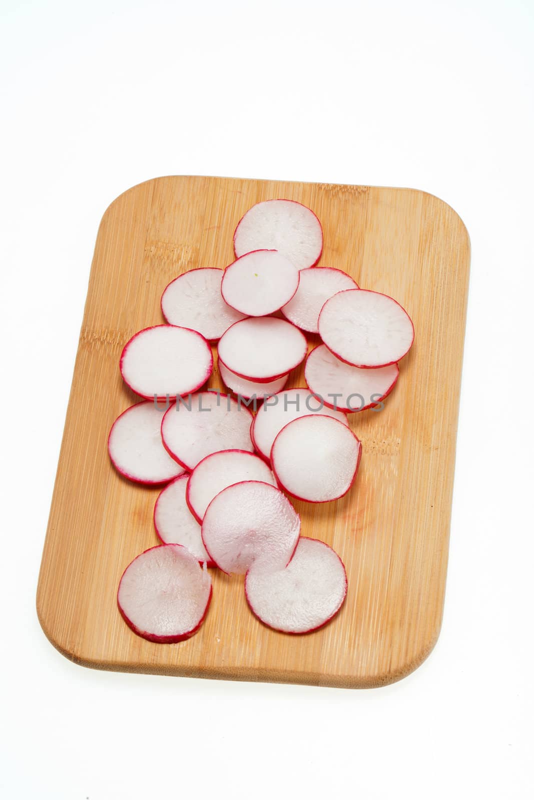 Garden radish on wooden board 