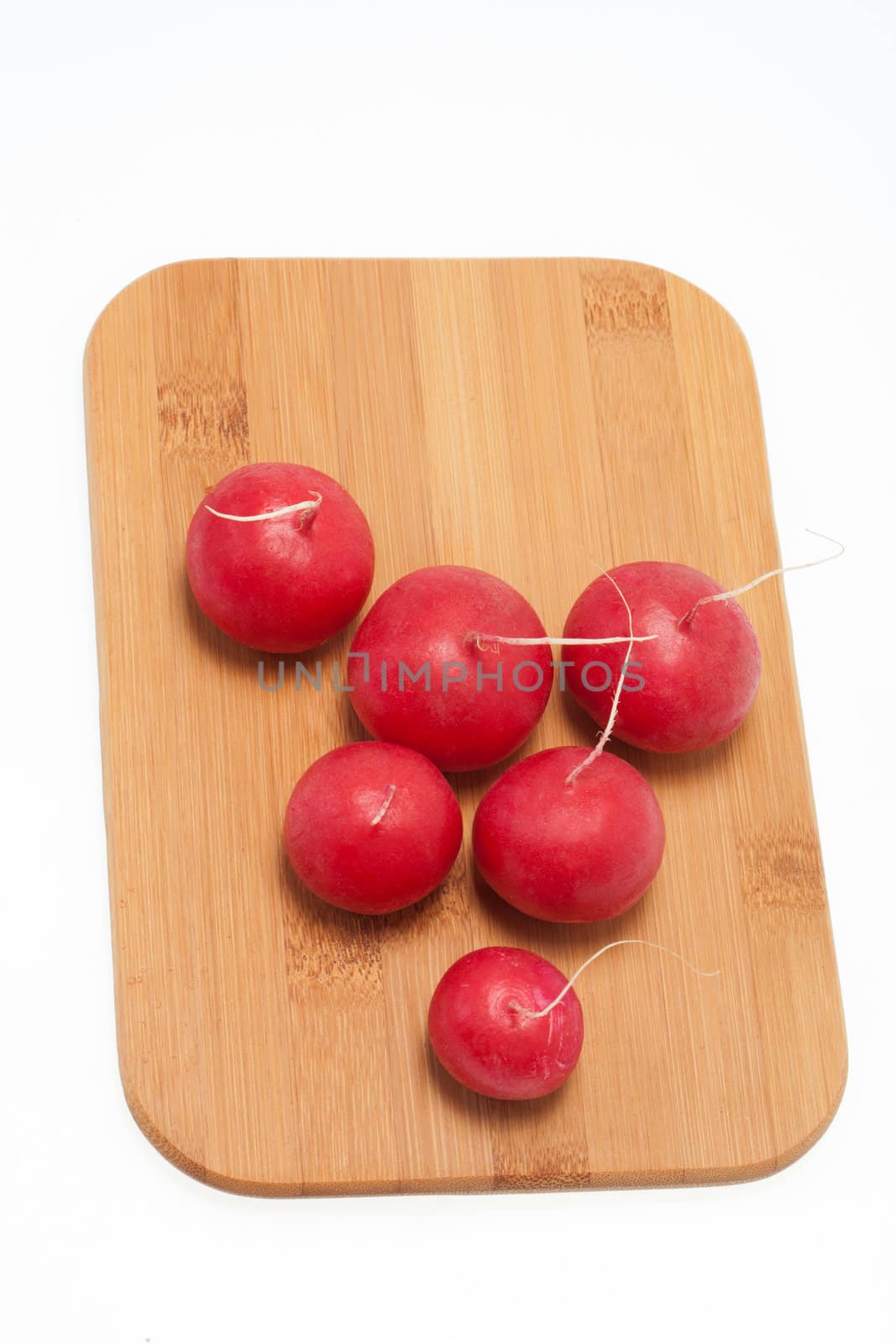 Garden radish on wooden board 