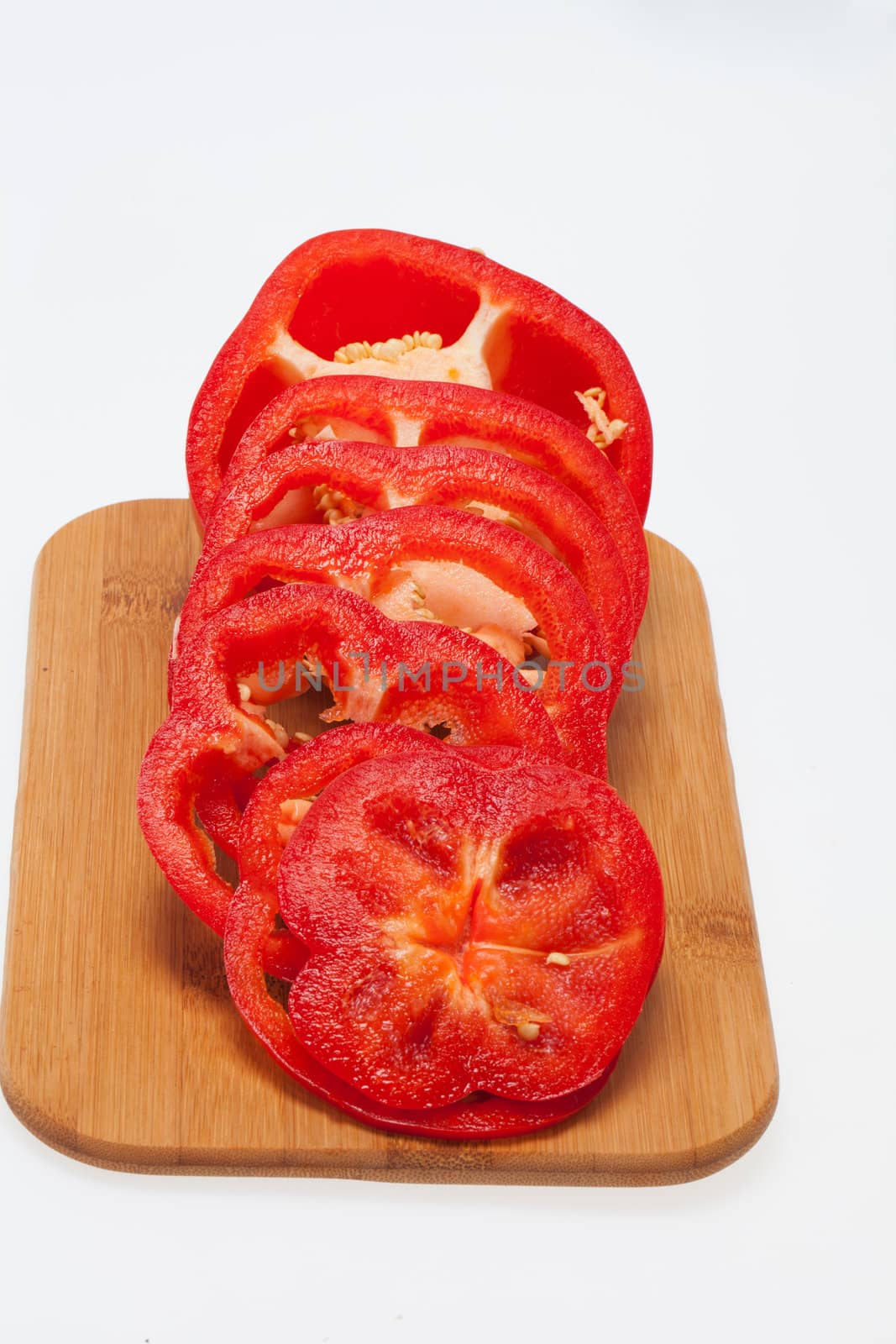 Sliced red pepper isolated on white background